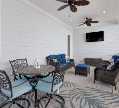 Relax on your private covered porch with comfy seating, ceiling fans, and entertainment—perfect for morning coffee or evening unwinding.