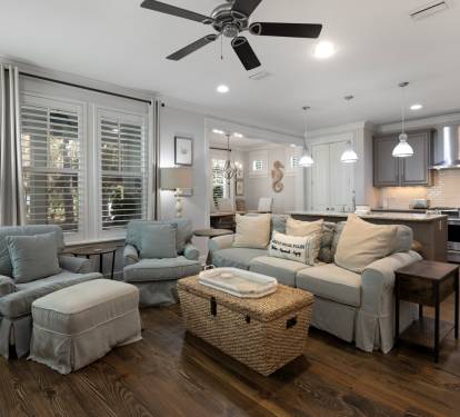 Sink into plush seating in this open-concept space where your living room flows seamlessly into a fully equipped kitchen, perfect for gathering.