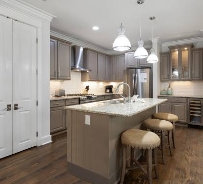 Your fully-equipped kitchen awaits with granite countertops, stainless appliances, and a breakfast bar perfect for morning coffee.