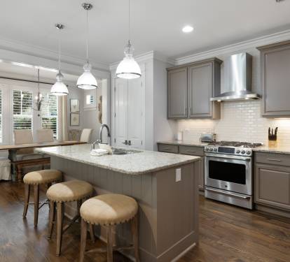 Your gourmet kitchen features granite countertops, stainless steel appliances, and a breakfast bar where you can savor morning coffee.