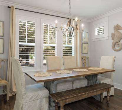 Gather around your elegant dining table where coastal charm meets comfort, perfect for memorable meals with loved ones.