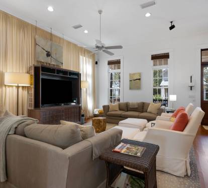 Relax in your spacious living room where plush sofas and warm lighting create the perfect gathering space for memorable evenings together.