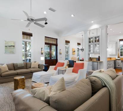 Relax in this bright, airy living space where plush sofas and open-concept design create the perfect gathering spot for your group.