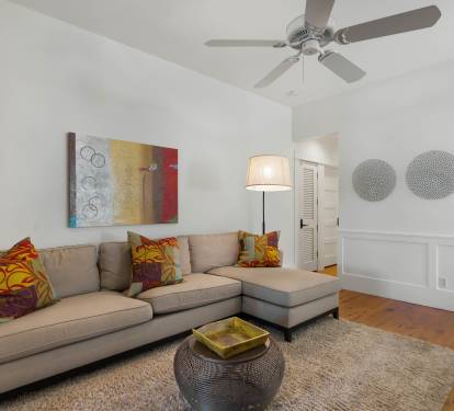 Relax in your stylish living room with cozy sectional seating, vibrant artwork, and thoughtful touches that make it feel like home.