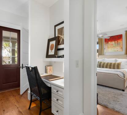 Unwind in your elegant bedroom suite with a cozy workspace nook, perfect for catching up on emails before sinking into plush bedding.