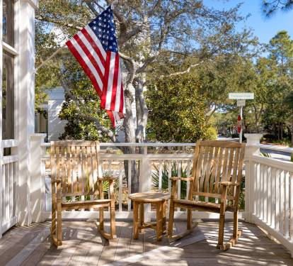 Your private deck offers peaceful moments with rocking chairs and patriotic charm, perfect for morning coffee or evening relaxation.