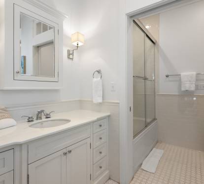 Step into your spa-like ensuite where marble countertops and soft lighting create a serene sanctuary for your morning routine.