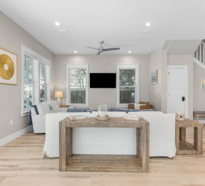 Unwind in your bright, airy living space with modern coastal charm and natural wood accents that create the perfect retreat.