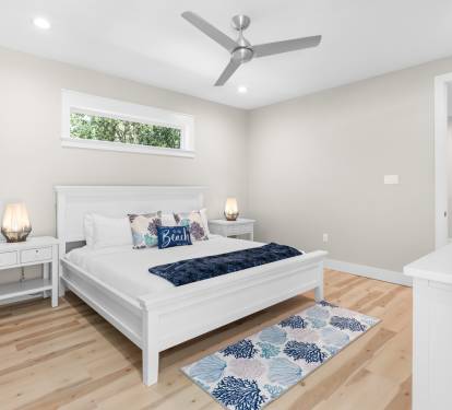 Rest peacefully in your bright, airy bedroom with crisp white linens and coastal touches that invite sweet dreams.
