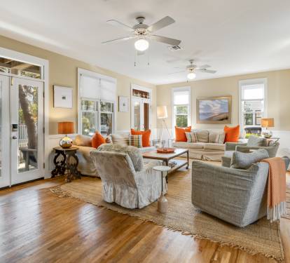 Relax in your spacious living room with cozy seating, warm fireplace, and French doors opening to your private outdoor space.