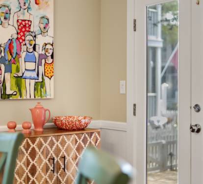 Bright dining space with colorful art and charming views invites you to enjoy meals in style.