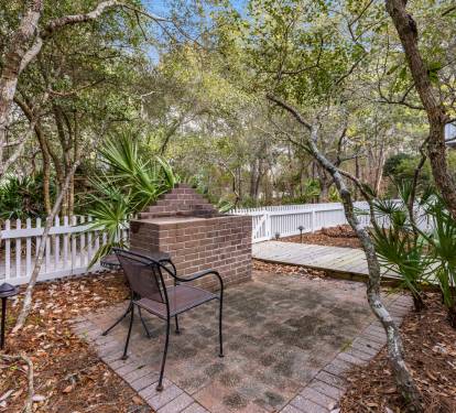Your private patio offers peaceful seating beneath mature trees, where you can relax with morning coffee or evening drinks.