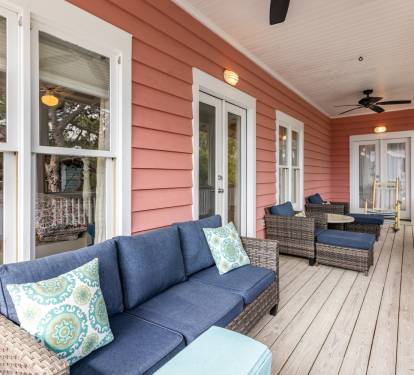 Relax on your private covered porch with comfy seating and coastal charm, perfect for morning coffee or evening conversations.