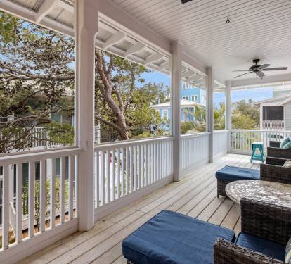 Unwind on your private screened porch with comfortable seating and ceiling fan - perfect for morning coffee or evening relaxation.