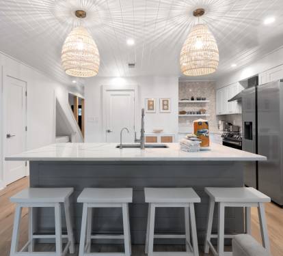 Your stylish kitchen awaits with a spacious island for gathering, modern appliances, and elegant pendant lighting creating the perfect culinary retreat.