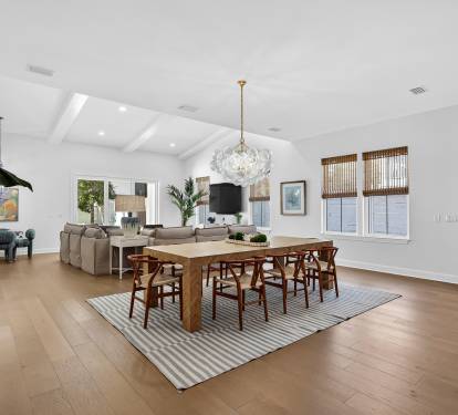 Unwind in this stunning open-concept space where natural light floods your dining and living areas through oversized windows.