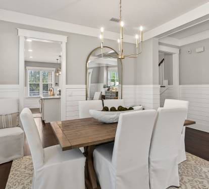 Step into your elegant dining space where warm wood meets crisp white details, perfect for memorable meals together.