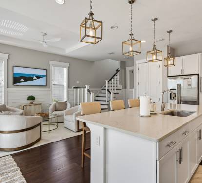 Step into your stylish open-concept space where the modern kitchen flows seamlessly into your living area, perfect for gathering and cooking.