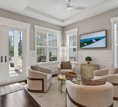 Sink into plush seating where natural light flows through elegant windows, creating your perfect retreat for morning coffee or evening conversations.