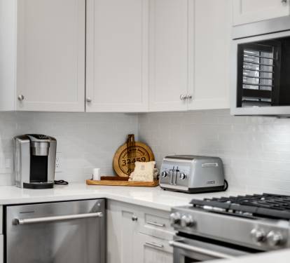 Your bright kitchen comes complete with modern appliances and thoughtful touches, ready for your culinary adventures.