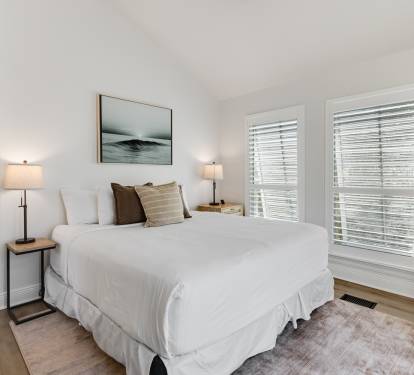 Drift into peaceful sleep in your serene bedroom, where soft linens and coastal artwork create the perfect retreat after your adventures.