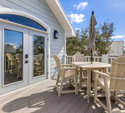 Step onto your private deck where morning coffee tastes better in coastal air, with comfortable seating perfect for sunset dinners and stargazing.