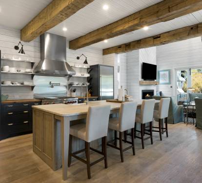 You'll love cooking in this stunning gourmet kitchen featuring exposed beams, premium appliances, and island seating for memorable meals together.