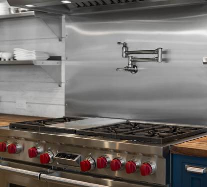 Create culinary masterpieces on your professional-grade gas range with pot filler convenience and abundant storage for all your cooking needs.