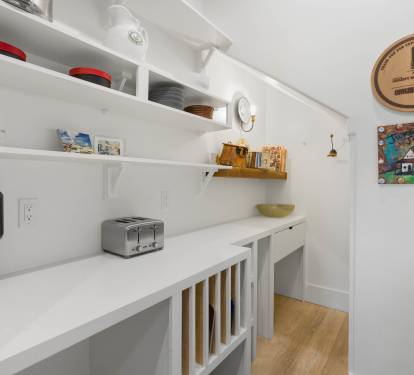 Your bright, organized pantry features everything you need—Ninja blender, toaster, and stylish storage for effortless meal prep.