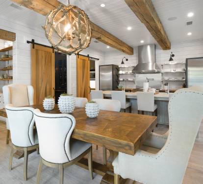 Gather around this stunning dining table where rustic wood beams meet modern elegance, creating the perfect space for memorable meals together.