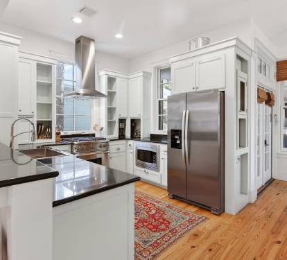 Cook memorable meals in your gourmet kitchen featuring gleaming granite counters, premium stainless steel appliances, and warm wood floors.