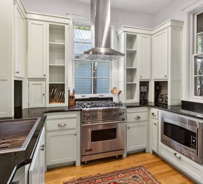 Your culinary dreams come alive in this stunning gourmet kitchen with professional appliances and elegant white cabinetry.