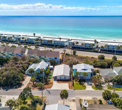 Stunning beachfront location with pristine white sand and turquoise waters just steps from your vacation home.