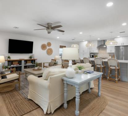 Relax in your bright, airy open-concept space where coastal charm meets modern comfort. You'll love the seamless flow from living to kitchen.