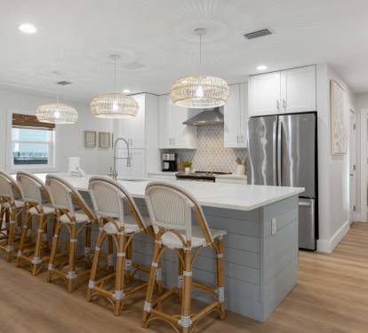 Your spacious chef's kitchen features modern appliances and a large island with seating for eight, perfect for memorable group meals.