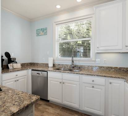 Your fully equipped kitchen features granite countertops, stainless steel appliances, and everything you need for memorable meals during your stay.