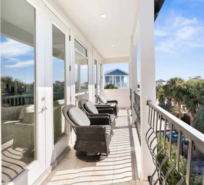 Relax on your private balcony with comfortable seating and tropical views, perfect for morning coffee or sunset unwinding.