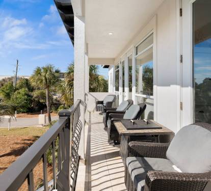 Relax on your private balcony with comfortable seating and dining space, perfect for morning coffee or evening meals.