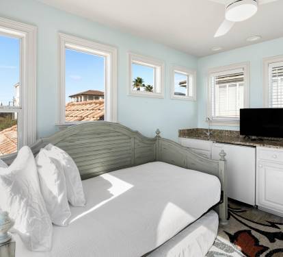 Drift off in your serene bedroom, where soft light pours through windows and coastal breezes refresh your dreams.