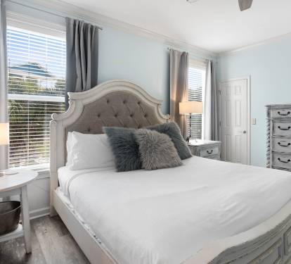Unwind in your elegant bedroom with plush linens and calming blue tones that promise peaceful nights of rest.