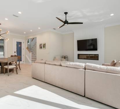 Sink into plush seating while enjoying your favorite shows on the wall-mounted TV, with elegant dining space perfect for memorable meals together.