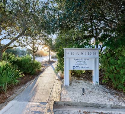Welcome sign marks your arrival at this charming Seaside community, established in 1981 and nestled among lush tropical landscaping.