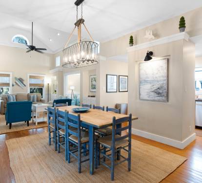 Gather around your spacious dining table where coastal charm meets comfort, perfect for memorable meals together.