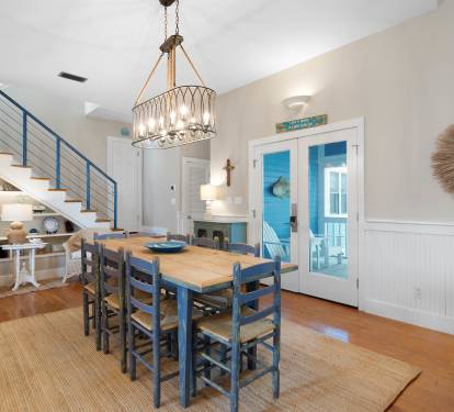 Gather around your beautiful dining table in this bright coastal-inspired space, where sea breezes flow through French doors onto your private balcony.
