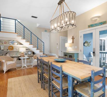 Gather around your charming dining table beneath nautical-inspired lighting, with coastal decor creating a relaxing atmosphere for memorable meals together.