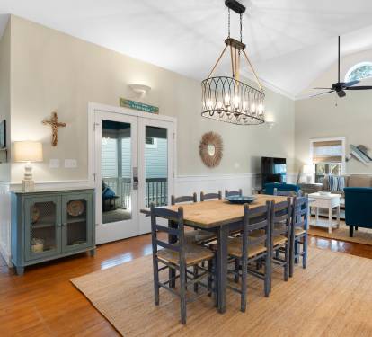 Gather around your spacious dining table for memorable meals, with coastal charm flowing through this open, sunlit space.