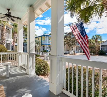 Step onto your charming front porch and feel the coastal breeze as you relax in comfortable chairs under the covered veranda.