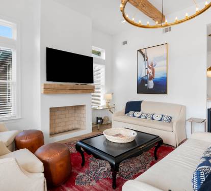 Unwind in your stylish living room featuring plush seating, modern fireplace, and thoughtful design touches that create the perfect atmosphere for relaxation.