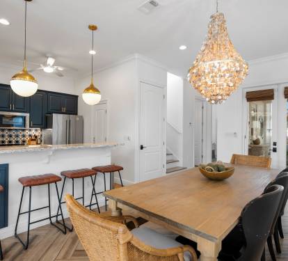 Gather around your elegant dining table under a stunning chandelier, while the open kitchen invites culinary adventures.