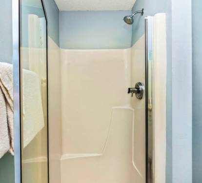 Your private shower features clean tile surroundings and modern fixtures for a refreshing start to each day.